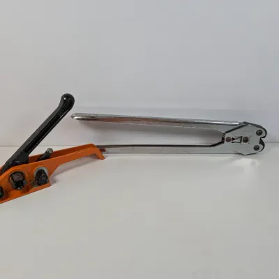 Sale Photo Thumbnail #300: Manual steel strapping tensioner and sealer tools, showing some wear from use.