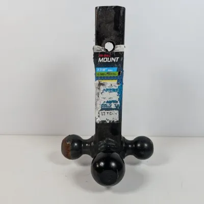 Sale Photo Thumbnail #139: Tri-ball trailer hitch mount in black finish, showing some wear and a worn product label.