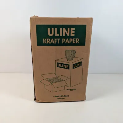 Sale Photo Thumbnail #298: Uline Kraft Paper dispenser box, designed for packing and shipping needs.