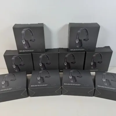 Sale Photo Thumbnail #304: Ten boxed KH-23 wireless headphones with directional mic design, stacked in a pyramid arrangement.
