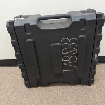 Sale Photo Thumbnail #293: Heavy-duty black molded plastic equipment transit case with integrated handle, marked with "TAB-033" in white lettering.