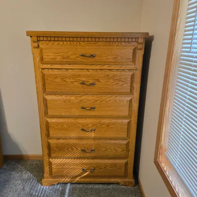 Sale Photo Thumbnail #53: Traditional oak tallboy chest of drawers featuring six spacious drawers with metal pulls and dentil molding detail along the top edge.