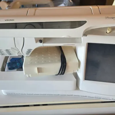 Sale Photo Thumbnail #108: Husqvarna Viking Designer SE computerized sewing and embroidery machine with foot pedal, showing some light wear from use.