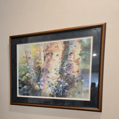 Sale Photo Thumbnail #30: Framed watercolor print depicting birch trees and wildflowers, presented in a double mat and a classic wooden frame.