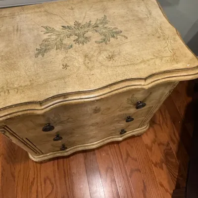 Sale Photo Thumbnail #36: Vintage French provincial style three-drawer chest featuring a hand-painted distressed finish with green acanthus leaf motifs and a serpentine front.