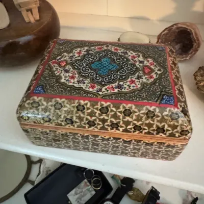 Sale Photo Thumbnail #196: Persian khatamkari and hand-painted miniature jewelry box, featuring intricate geometric inlay and a floral medallion design on the lid.