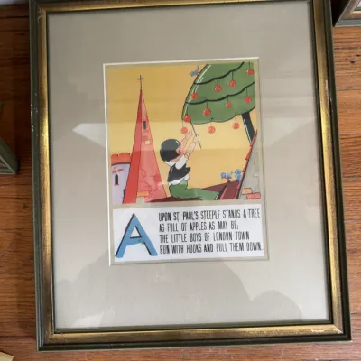 Sale Photo Thumbnail #203: Framed vintage nursery rhyme print featuring the letter 'A' and the verse 'Upon St. Paul's Steeple Stands a Tree', housed in a gold-trimmed wooden frame with a wide mat.