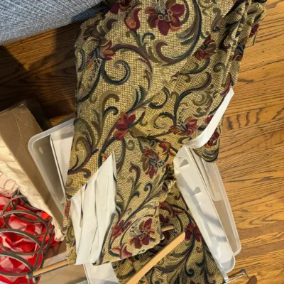 Sale Photo Thumbnail #302: Heavy tapestry-style drapery panels featuring a traditional floral and scroll pattern in gold, burgundy, and green tones, shown with white lining.