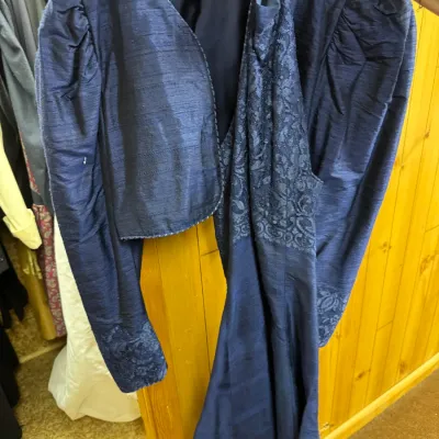 Sale Photo Thumbnail #93: Vintage navy blue formal dress and matching cropped jacket, featuring lace detailing and puffed shoulders, circa 1980s.