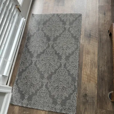 Sale Photo Thumbnail #30: Rectangular accent rug featuring a grey and white damask pattern, shown on a wood-look floor.