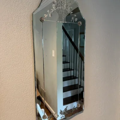 Sale Photo Thumbnail #62: Vintage Venetian-style frameless wall mirror featuring an etched floral basket design at the top and delicate floral borders.