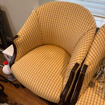 Sale Photo Thumbnail #63: Vintage barrel-back armchair featuring yellow and brown plaid upholstery and dark wood trim.
