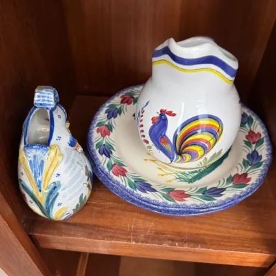 Sale Photo Thumbnail #283: Hand-painted Italian ceramic pitcher and plate set featuring a colorful rooster motif, accompanied by a small decorative ceramic vessel.