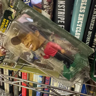 Sale Photo Thumbnail #17: Vintage Upper Deck PlayMakers Tiger Woods "Tiger Slam" bobblehead figure, new in its original clamshell packaging.