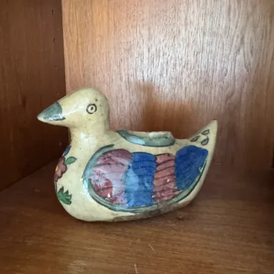 Sale Photo Thumbnail #287: Vintage hand-painted ceramic duck planter, featuring colorful wing details and a crazed glaze finish.