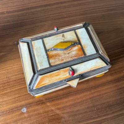 Sale Photo Thumbnail #285: Vintage Tibetan or Himalayan style decorative box featuring bone paneling, metal wirework, and inset coral and amber-colored stones.