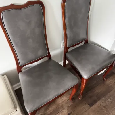 Sale Photo Thumbnail #26: Pair of Queen Anne style dining chairs with cherry-finished wood frames and grey faux-leather upholstered seats and backs.