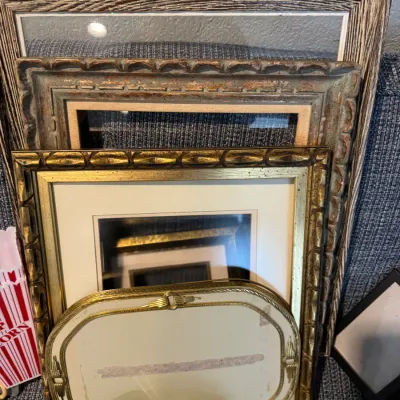 Sale Photo Thumbnail #301: Assortment of vintage picture frames in various sizes, featuring ornate gold-gilt, rustic wood, and distressed finishes.