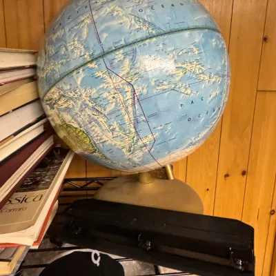 Sale Photo Thumbnail #40: Vintage Replogle world globe with a raised-relief surface, mounted on a gold-toned metal base.