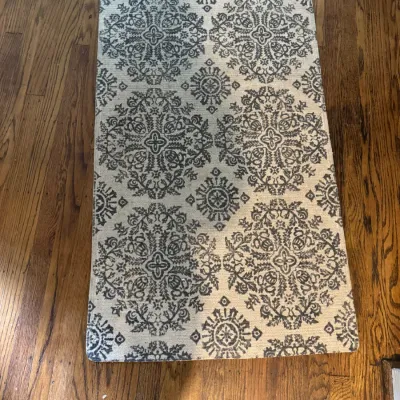 Sale Photo Thumbnail #339: Rectangular area rug featuring a grey and off-white damask medallion pattern, shown on a hardwood floor.