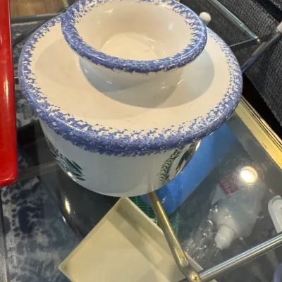 Sale Photo Thumbnail #261: Vintage ceramic French butter keeper featuring a white glaze with blue spongeware trim and green leaf motifs.