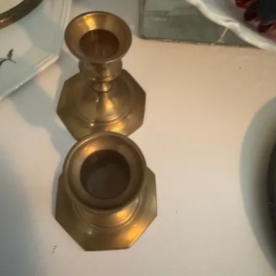Sale Photo Thumbnail #183: Pair of vintage brass candlesticks with octagonal bases, showing a warm patina.