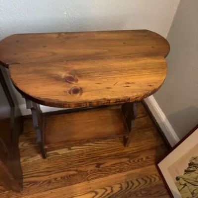 Sale Photo Thumbnail #27: Rustic pine drop-leaf console table with a lower shelf, showing natural wood grain and knots.