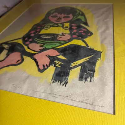 Sale Photo Thumbnail #9: Framed and matted mid-century woodblock print by artist Ted Freedman, numbered 7/50 and signed in pencil, depicting a child eating from a bowl.