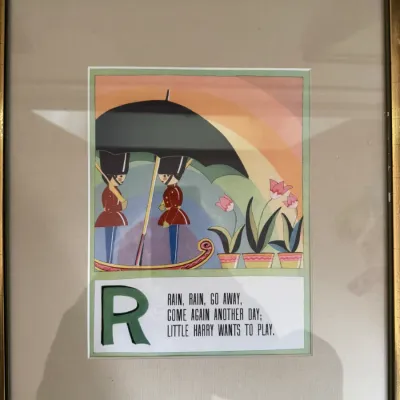 Sale Photo Thumbnail #200: Framed nursery rhyme illustration for the letter 'R' featuring the 'Rain, Rain, Go Away' poem, styled with Art Deco-inspired toy soldiers under an umbrella.