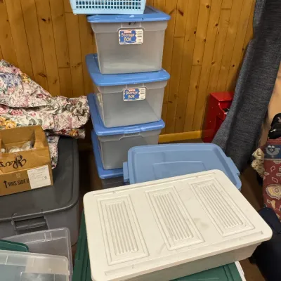 Sale Photo Thumbnail #112: Assorted plastic storage bins and totes in various sizes and colors, including a stack of clear Sterilite boxes with blue lids.