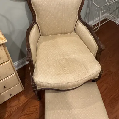 Sale Photo Thumbnail #25: Vintage French Provincial style armchair and matching ottoman, featuring a dark wood frame and beige patterned upholstery.