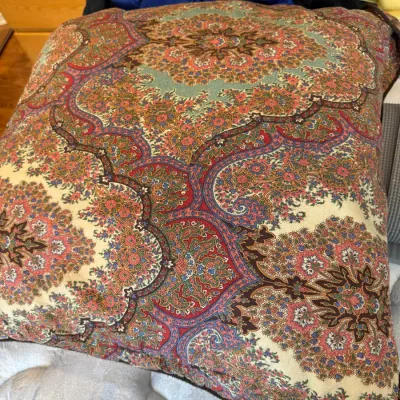Sale Photo Thumbnail #43: Large square throw pillow featuring an intricate Persian-style paisley and floral medallion pattern in shades of red, green, cream, and brown.