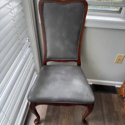 Sale Photo Thumbnail #29: Vintage Queen Anne style dining chair featuring a cherry-finished wood frame with cabriole legs and grey faux-leather upholstered seat and backrest.