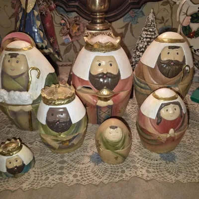 Sale Photo Thumbnail #47: Hand-painted Russian nesting doll nativity set, featuring Wise Men, shepherds, Mary, and Baby Jesus figures in rounded egg-shaped forms.