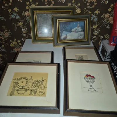 Sale Photo Thumbnail #10: Collection of framed vintage art pieces, including still life line drawings of glassware and fruit, along with framed winter landscape and city prints in decorative wood frames.
