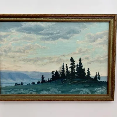 Sale Photo Thumbnail #29: Vintage oil painting depicting a landscape with pine trees on a hill, signed Clara Van Wering, housed in a carved wooden frame.