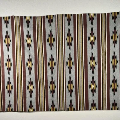 Sale Photo Thumbnail #14: Woven Southwestern-style textile or rug featuring vertical stripes and geometric diamond motifs in brown, grey, gold, and white.