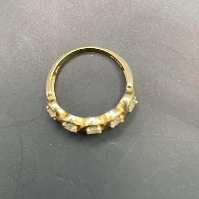 14K yellow gold ring with five tested diamonds. Approximately size 6. Total weight including stones: 2.56 grams. 