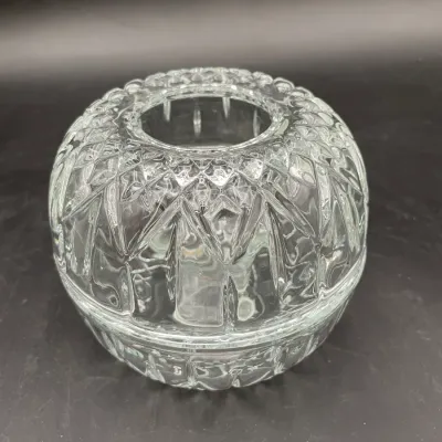 Vintage cut glass fairy lamp or candle holder, featuring a dome-shaped top with geometric patterns and a matching base.