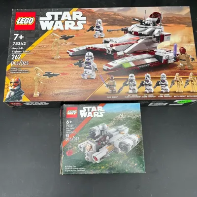 Two sealed LEGO Star Wars sets, including Republic Fighter Tank (75342) and The Razor Crest Microfighter (75321), showing some light...
