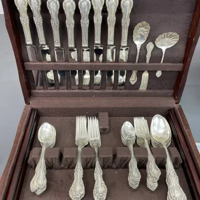 International Sterling Wild Rose pattern flatware service with forks, spoons, knives and serving pieces. Sterling pieces excluding knives...