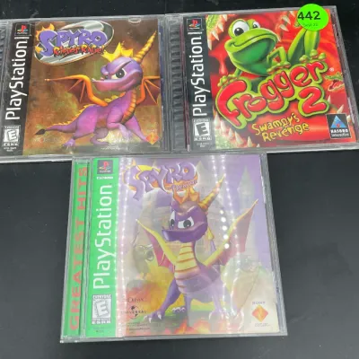 Three original Sony PlayStation video games in jewel cases, including Spyro 2: Ripto's Rage!, Frogger 2: Swampy's Revenge, and...