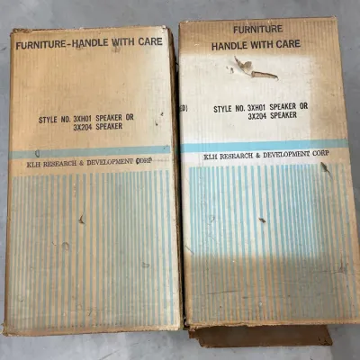 Pair of vintage KLH Research & Development Corp speaker boxes, style number 3XH01 or 3X204, showing some wear and tear from age.