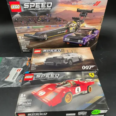 Three boxed Lego Speed Champions sets, including Mopar Dodge//SRT Top Fuel Dragster and 1970 Dodge Challenger T/A (76904), 007 Aston...