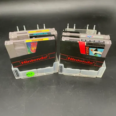 Collection of vintage Nintendo Entertainment System (NES) game cartridges, including Dragon Warrior and Super Mario Bros./Duck Hunt,...