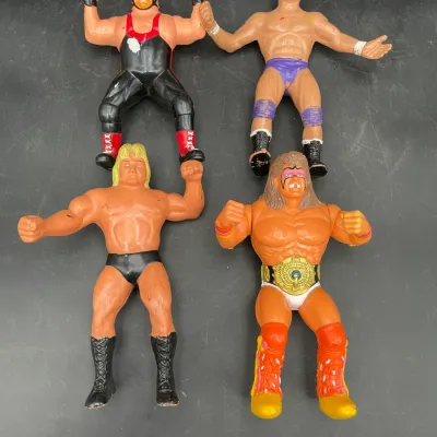 Four vintage WWF LJN wrestling action figures from the 1980s, including Vader, Paul Orndorff, Hulk Hogan, and the Ultimate Warrior,...