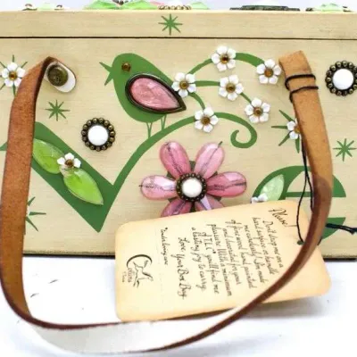 Vintage Enid Collins "Love" wooden box purse, featuring hand-painted details, jewel embellishments, and a leather handle, circa...