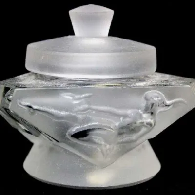 Art Deco style frosted and clear glass inkwell or vanity jar, featuring a relief of a diving female figure on the front.