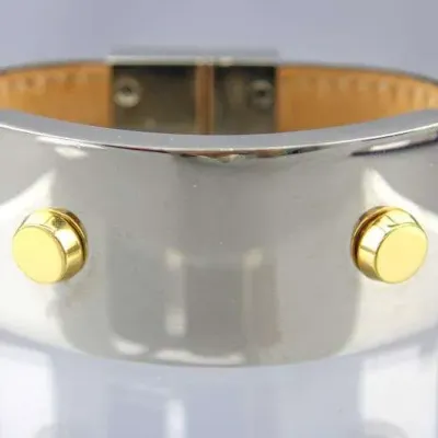 Hermes Behapi double tour leather bracelet featuring a silver-tone metal plate with gold-tone accents.