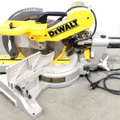 DeWalt sliding compound miter saw, showing some light wear from typical workshop use.
